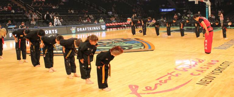 Master Ken students performs during WNBA game