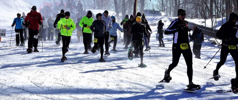 PHOTO BY VERA OLINSKI And they're off! The Super Snowshoe Shuffle participants begin.