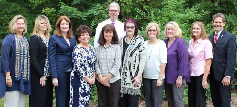 Tom Shara stands with Lakeland colleagues who reached service anniversaries of 20 to 40 years. From left to right: Debbie Morris, Laurie Corcoran, Karen Kennedy, Connie Meehan, Maureen McCully, Patricia Dorrbecker, Patricia Foster, Ruth Schreiber, Joanne Paddock and Bob Vandenbergh. Not pictured: Michele Gilchrist, Janice Hicks, Matt Salmon, and Yvonne Sebecke.