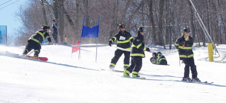 Firefighters ski for charity PHOTOS BY GEORGE LEROY HUNTER The Vernon Township Fire Department got off to a bad start losing a team member who fell.