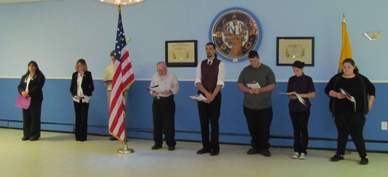 Elks host 9-11 ceremony Pictured, from left, during a moment of silence are: Elks officers, Ava Sanderson, Ashley Green, David Morgan, behind flag, Jim Adams Jesse Morgan; and Antlers officers, Andrew Lang, Haley Szabo and Kaitlyn Butler.