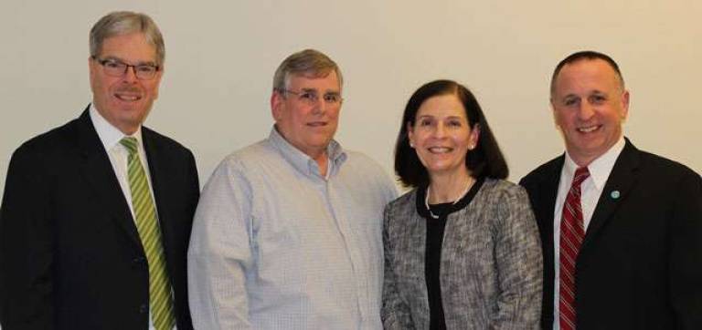 President and CEO Tom Shara, left, stands with colleagues celebrating 10 years of service with Lakeland Bank. Left to right is William Reul, Linda Smith and Jeff Beebe.