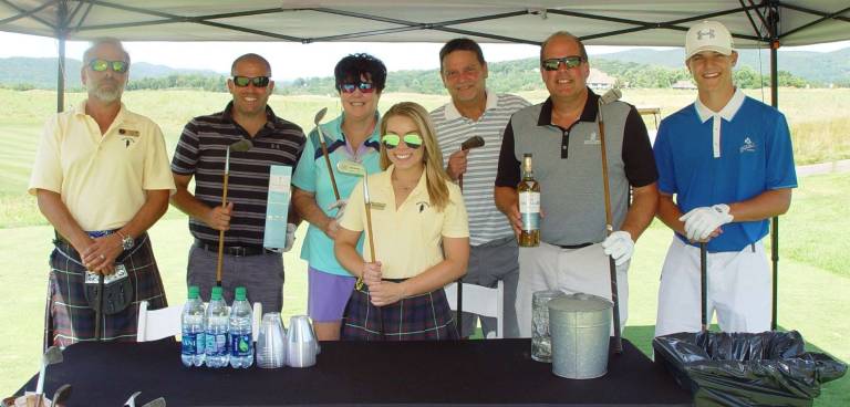Ballyowen hosts Macallan Scotch tournament Ballyowen Ranger Joe, Christine and golfers enjoy some Macallan Scotch prior to teeing off on the 4th hole using hickory golf clubs.