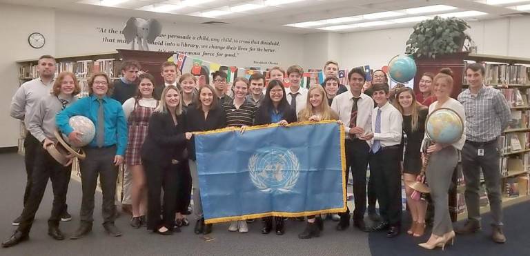 They are pictured here with advisors Guy Della Tore (at left) and Kelsey Falkowski (at right), both teachers in the Social Studies department.