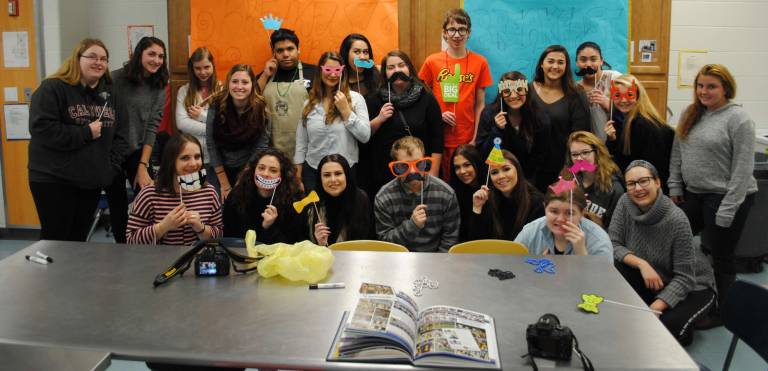 In what has become an annual ritual, students on Jim LaBar&#xfe;&#xc4;&#xf4;s Yearbook staff spent some time with the Breakfast Club Life Skills students showing them how to work the digital cameras and take fun and funky photos. Armed with props and enthusiasm, all the students shared their love of fun and discovery, masks and mustaches included.