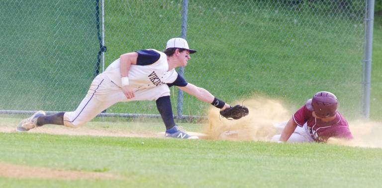 In the second inning Newton runner Scott Price slides safe onto third base before the tag by Vernon's Adam Driscoll.