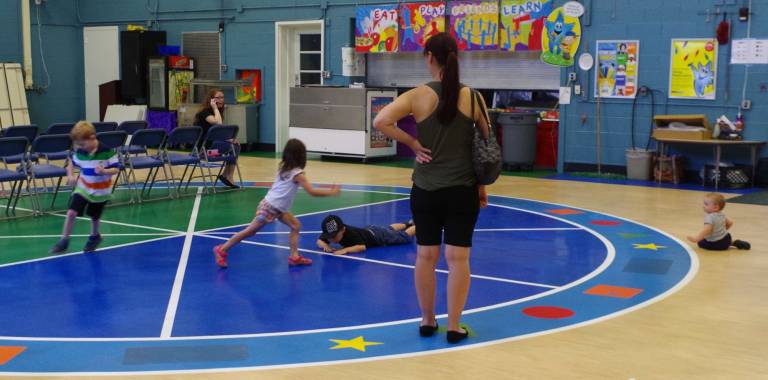 Young children were able to frolic on the gymnasium floor of the multi-purpose room.