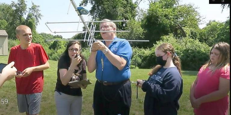 Nashua Area Radio Society president Fred Kemmerer talks to students about capturing satellite messages (Photo provided)