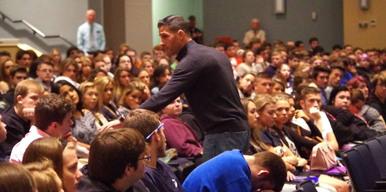 Mathew Maher is shown during his presentation to juniors and seniors at Vernon Township High School. He made his message personal as he walked up and down the aisles of the auditorium and looked students directly in their eyes.