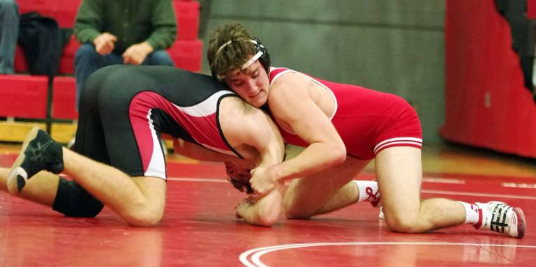 High Point's Sawyer Fenlon (red) grabs Westwood's Christopher Dugan in the 145 lbs match.