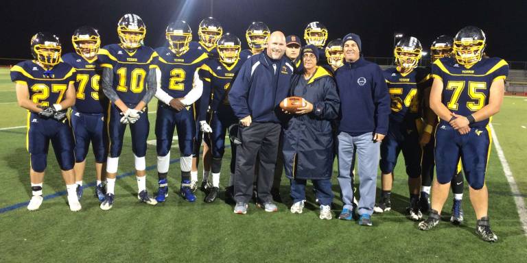 New Vernon Township Athletic Director Bill Foley, varsity football coach Chuck Tepper and the seniors of the football team present Bill Edelman (retiring AD) with the game ball prior to the game against Tenafly on Thursday, Nov. 10. The game ball signed by all the players and coaches was given to Mr. Edelman for all his dedication and support for the Football program for the last 23 years as athletic director.