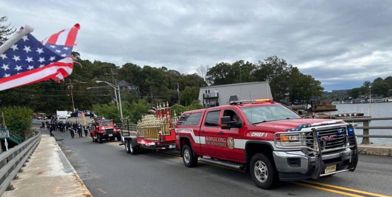 A Hopatcong Fire Department vehicle pulls a trailer carrying trophies to be awarded later Saturday, Oct. 7. (Photos by Daniele Sciuto)