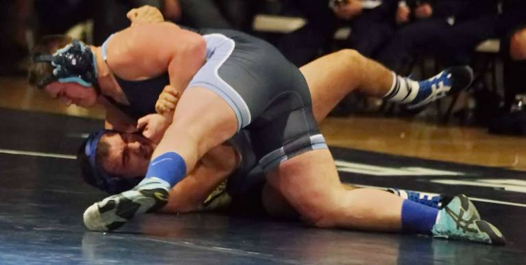 Sparta's Gavin Lally on top of Vernon's Mike Alvarez in the 220-pound weight class.