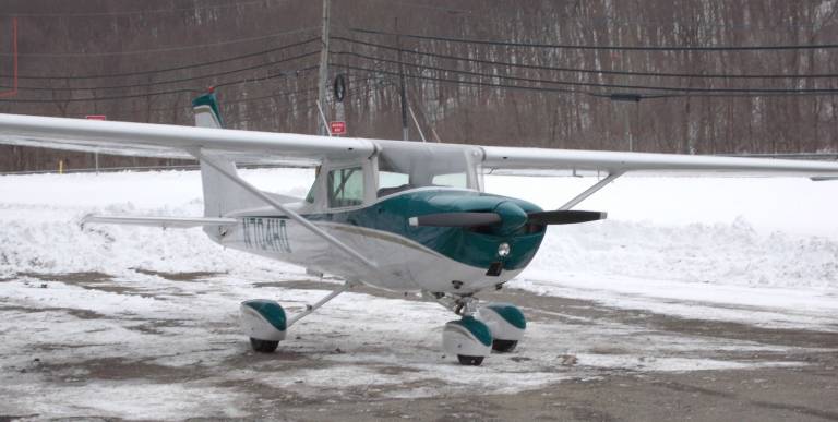 Plane makes emergency landing Photo by Vera Olinski A small plane waits to be towed after making an emergency landing on Route 23.