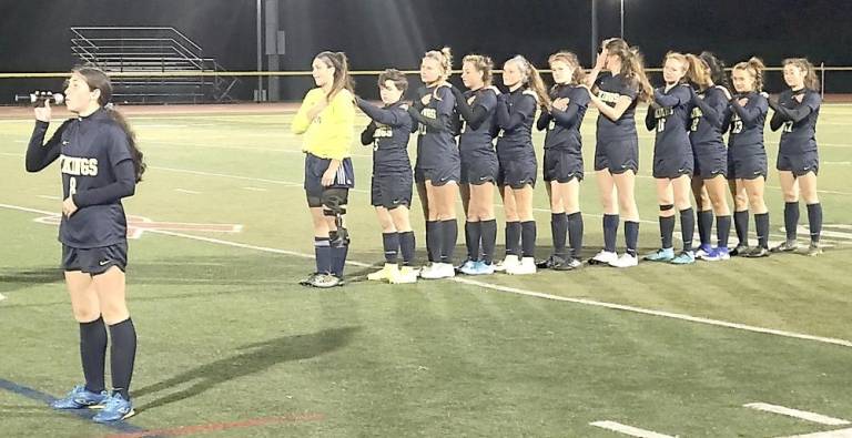 Junior Hannah Kolonoski singing the national anthem.