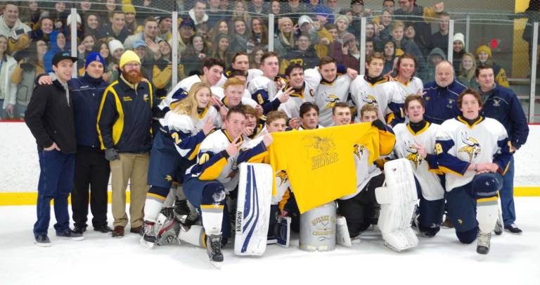 The Vernon Vikings pose with the Sussex Cup after earning the championship title.
