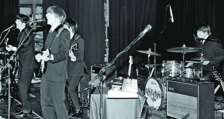 Photo by Nicholas Ortiz The Beatles incarnate play for the crowd at High Point High School.