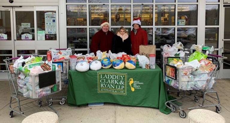 Law firm collects food for needy