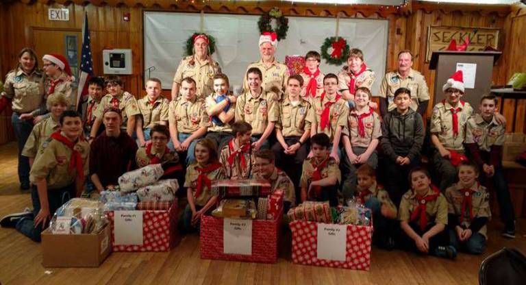 Boy Scout Troop 912 gather for their annual holiday party at the Highland Lakes Clubhouse and enjoy playing Secret Santa, providing gifts to three local families in need.