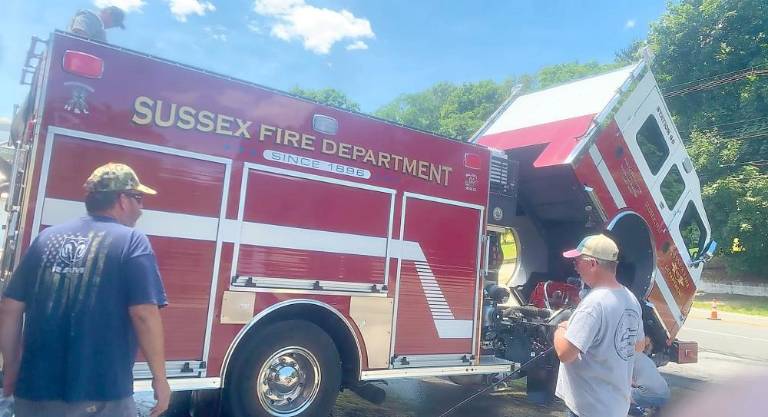 An engine with the Sussex Fire Dept. preps for a parade.