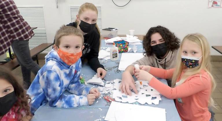 Students chill with friends at Cedar Mountain’s ‘Winter Wonderland’ Making snowflakes (Photo provided)