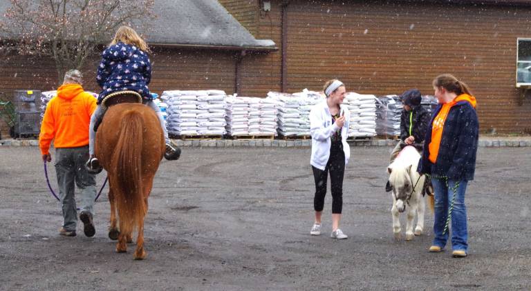 Undeterred by a little wet snow, horse and pony rides were offered by Wantage-based Pepper's Pony Express.