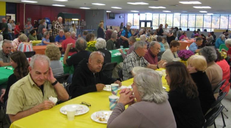 PHOTOS BY JANET REDYKE The annual turkey dinner at Vernon Township High School was crowded with turkey lovers on Saturday, Oct. 21. According to Harvest House President Denise O' Connor and Secretary Peggy Behnke, 48 turkeys were cooked and a benefit donation of $4,000 was hoped for the House.