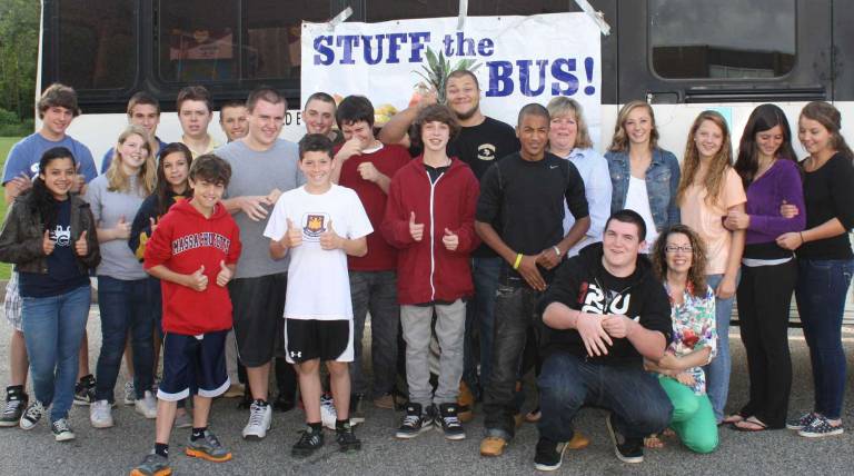 Wallkill High is now home of charitable 'champions' Proud students give a thumbs up for their success in collecting food donations for area residents in need.