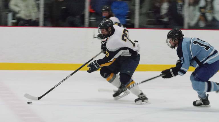 Vernon beats West Morris Vernon's Patrick Graham in conrtol of the puck.