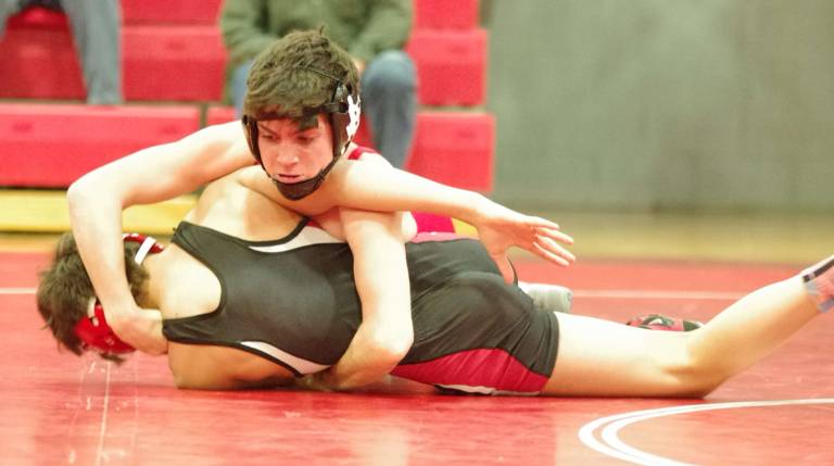 High Point's Devon Liebl on top of Westwood's Ethan Fernandez in the 106 lbs match. Liebl won by decision 7-5.