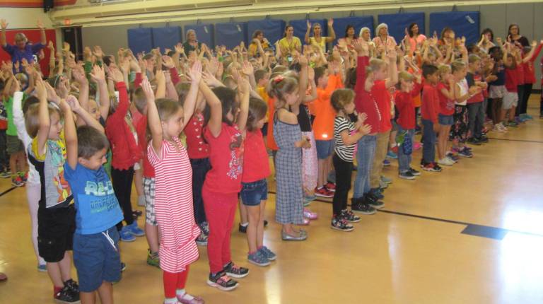 PHOTOS BY JANET REDYKEStudents of Cedar Mountain Primary School enjoy a concert on Friday Oct. 6.