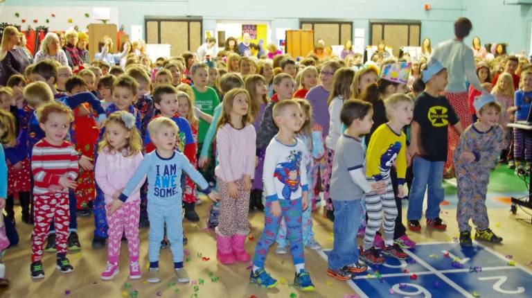 Students are shown thrilled as confetti marks the occasion.