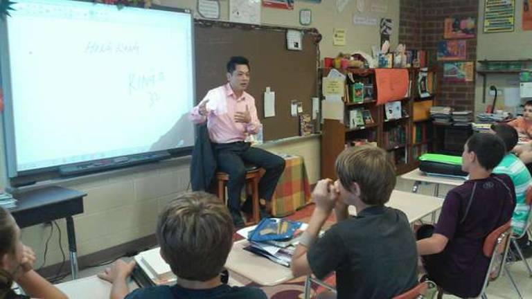 Glen Meadow students get visit from Vernon business owner Kingo Wong, owner of Wings restaurant in Vernon, talks to Glen Meadow Middle School students.