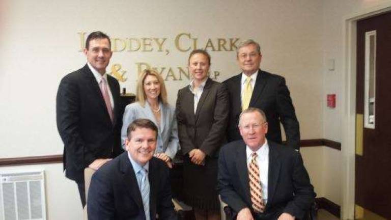 Picture in front from left are, partners Andrew Fraser, Managing Partner, Tom Ryan; and back from left, Tom Prol, Lauren Fraser, Ursula Leo, and Richard Sweeney.