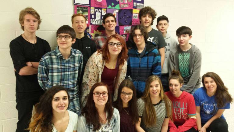 Sophomores in Mrs. Longchamp&#x2019;s English Class pose with their winning quilt in the Color Purple Quilt Contest.
