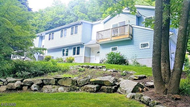 Private splendor in intimate lake community 63 Beaver Run Road