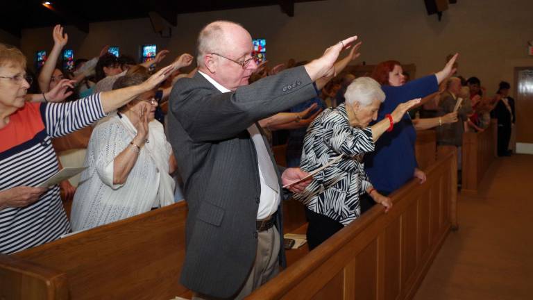 Celebration in honor of Father Bob’s retirement After having received blessings from Father Bob for 16 years, attendees of his retirement service give their blessings to him.