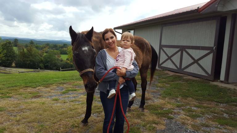 Victoria Shade with daughter Olivia and horse Moonshine