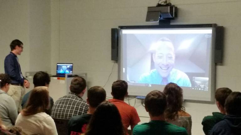 Candidate talks to high school students