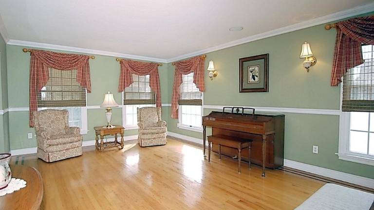 Spacious center hall colonial has in-ground pool