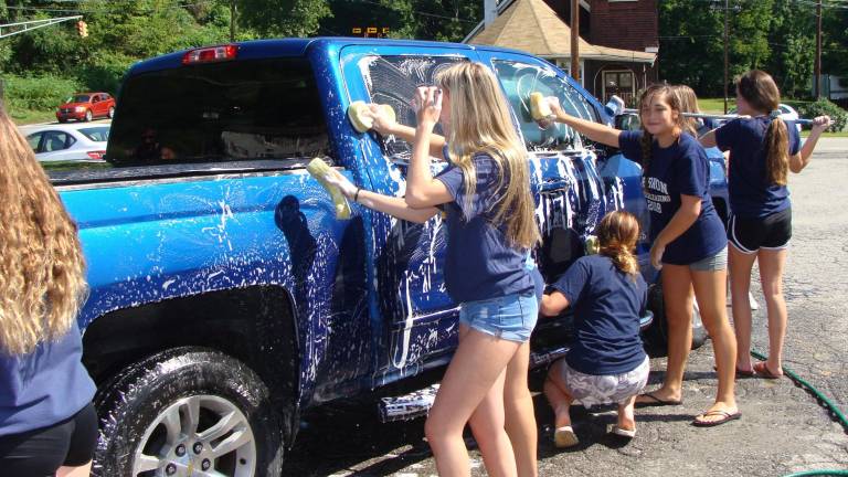 Vernon cheerleaders hold benefit car wash Vernon cheerleaders hold benefit car wash