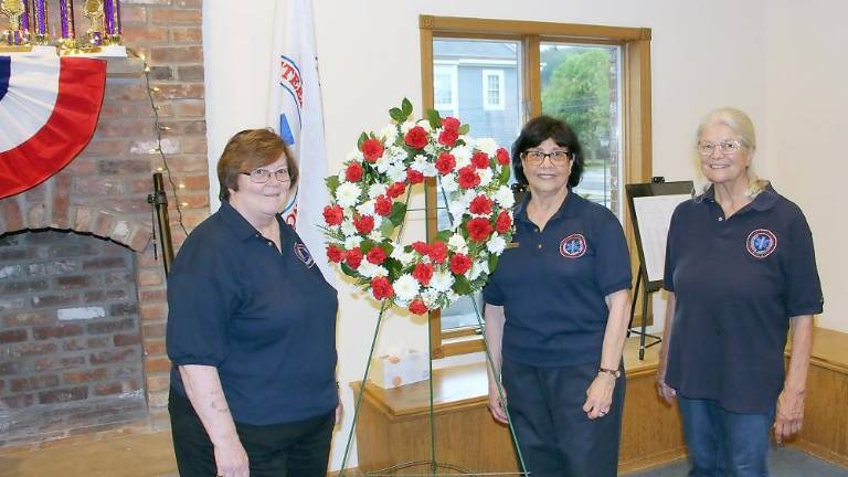 Sparta Ambulance Squad re-dedicates Memorial Garden to remember fallen members The ceremony was organized by squad member Arlene Kayne (center) with help from members Janice Johnson (left) and Renee Ferguson (right) (Photo provided)