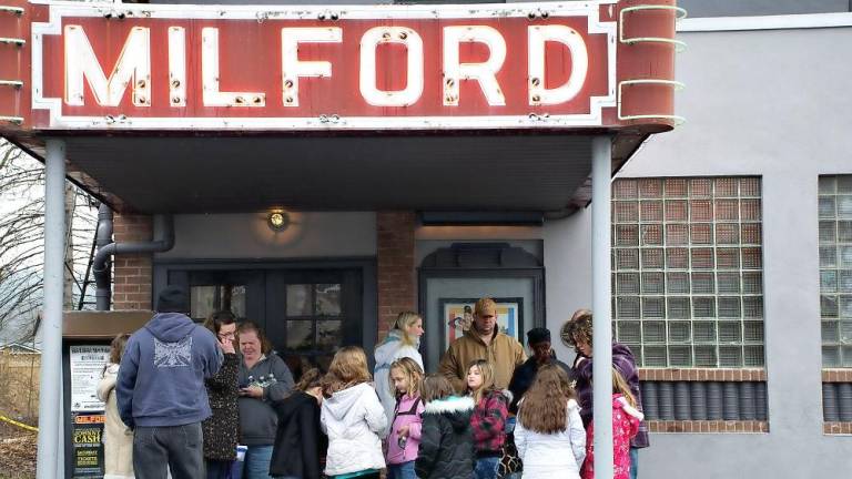 Patrons at the Milford Theater in pre-pandemic times (File photo by Marta Serra-Jovenich)