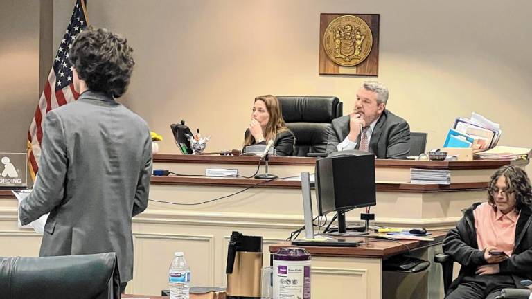 Sussex County Bar Association president Brent Rafuse and secretary Vanessa Henderson judge a preliminary round of the Sussex County High School Mock Trial Competition. (Photos by Travis Nunziato)