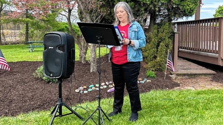 Rose Wolverton, president of the Snufftown Garden Club, speaks at the dedication of a Blue Star Memorial in Vernon. (Photos by Daniele Sciuto)