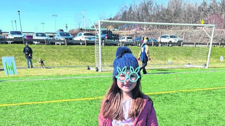 Madison Kammerer, 5, of Vernon wears bunny glasses at the annual Easter Egg Trail at Maple Grange Park.