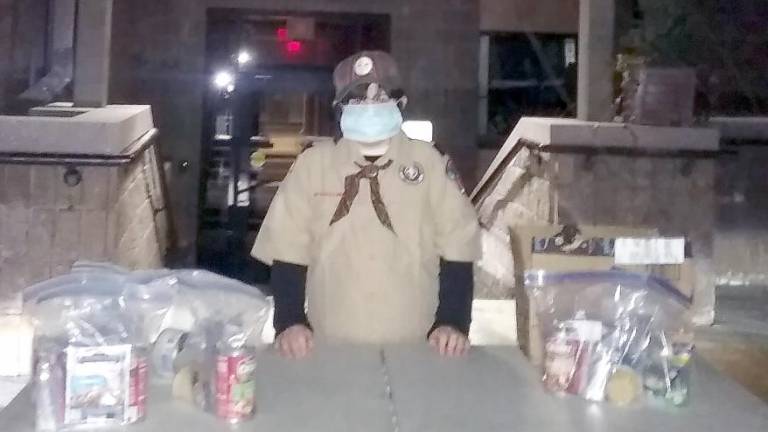 A Scout with blizzard packs at the senior center (Photo by Melissa Cole)