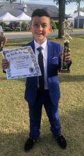 Jacob Lopez of Vernon poses with his certificate and trophy.