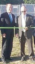 <b>Pictured at a ribbon-cutting (from left) are Assistant Superintendent Dr. Charles McKay and Business Administrator Steve Kepnes.</b>