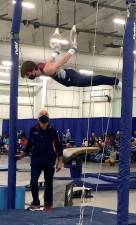 Vernon’s Colin Duffy competes on the rings.